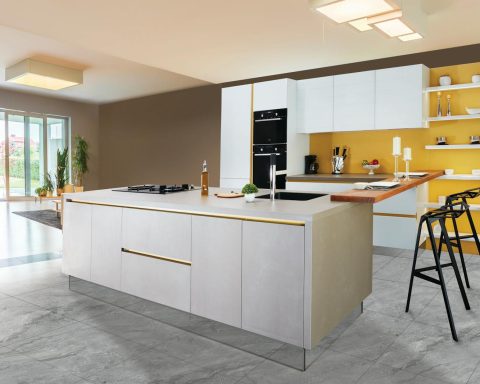 Sleek and modern kitchen interior featuring a large island and open shelving in a contemporary setting.